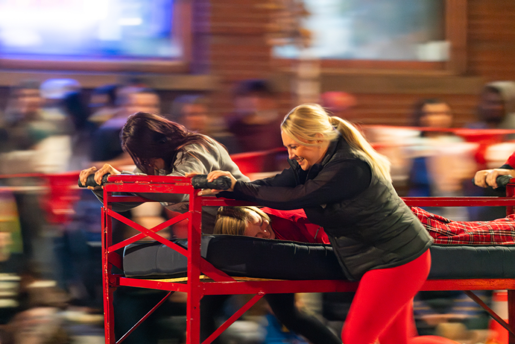 Students competing in the bed races.