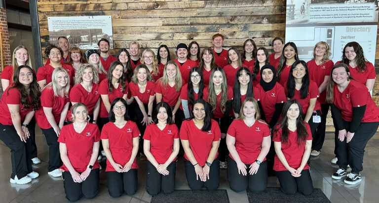Photo of nursing student cohort in their red EWU scrubs.