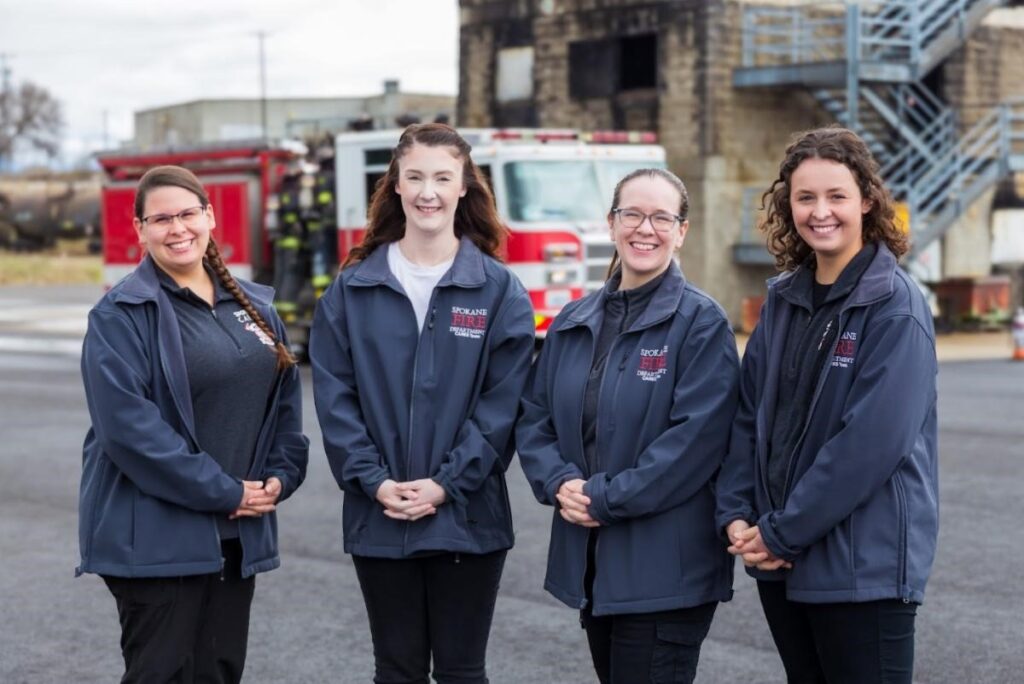 Photos of four social work students standing near a firetruck.