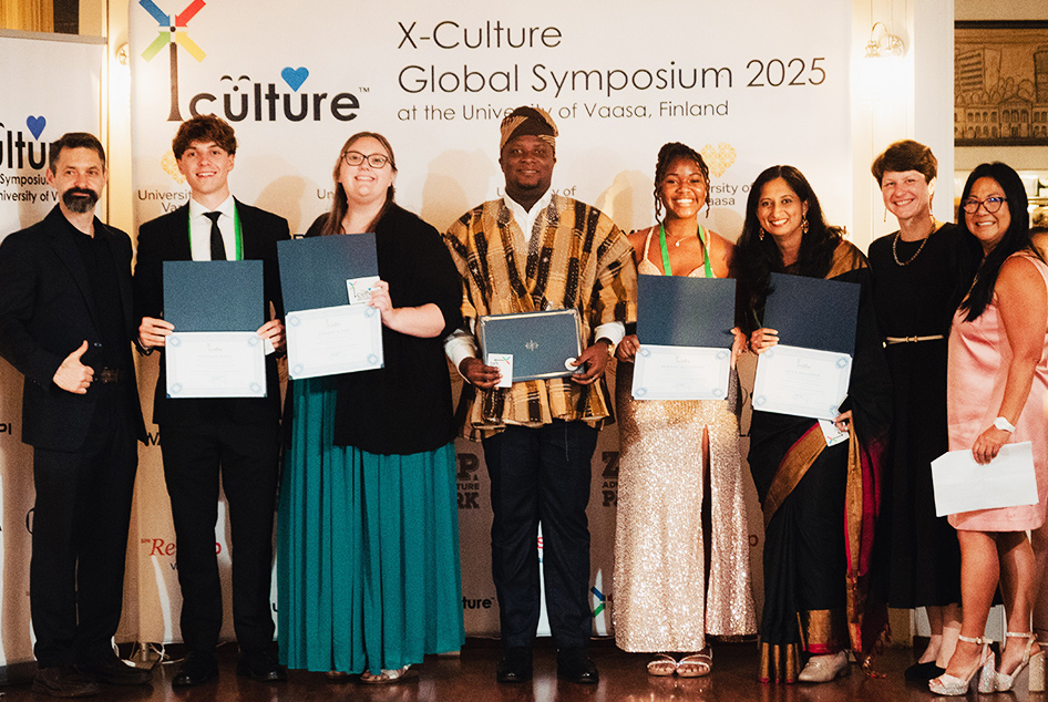 X-Culture team of eight with EWU student.