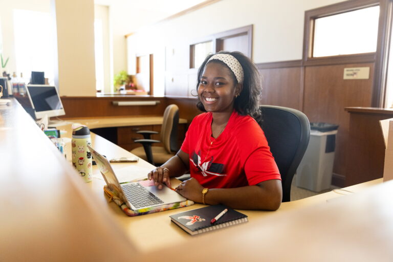 EWU student Maia Tonoukouin working at a desk