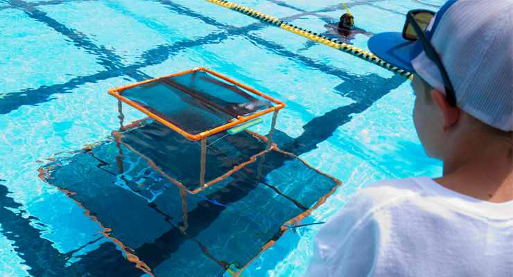 Photo: Robotics team tests their submersible
