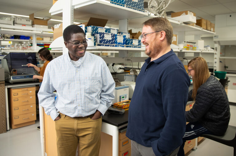 Nick Burgis (right) and co-principal investigator Yao Houndonougbo in Burgis’ Science Building laboratory.