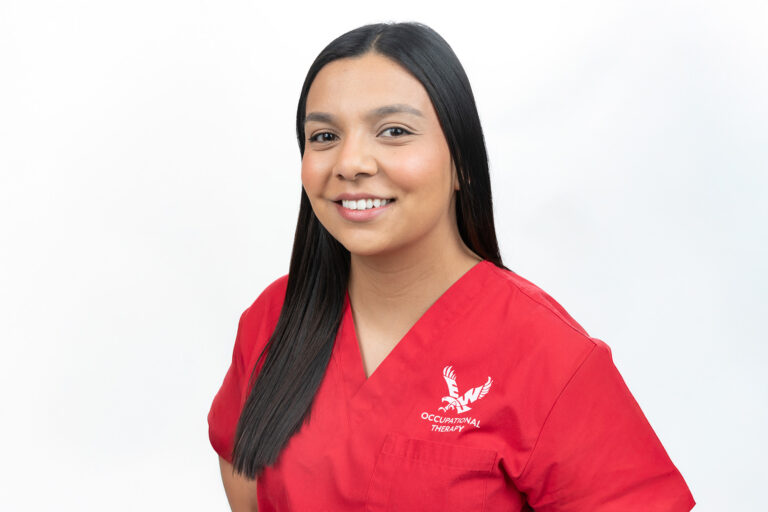 Photo of Tanya Valdenea wearing her red OT Eagle logo shirt.