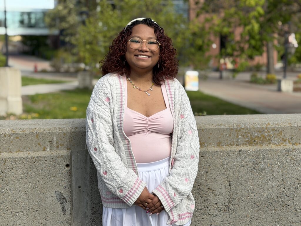Maria Sarmiento is pictured standing outside of JFK Library.
