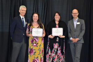Dean's Excellence Award recipient Taylor Alyse Clarke stands with her Faculty Mentor Kristina Ploeger-Hekmatpanah and Co-Dean's Brian Donahue and Pete Porter