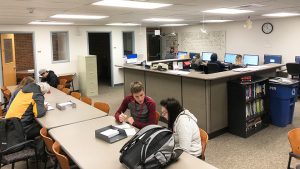 students work at desks in the lab